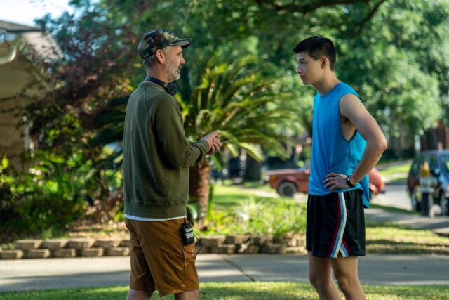 BOOTS. (L to R) Director Peter Hoar (101) and Liam Oh as Ray McAffey behind the scenes of Episode 101 of Boots. Cr. Alfonso "Pompo" Bresciani/Netflix © 2023