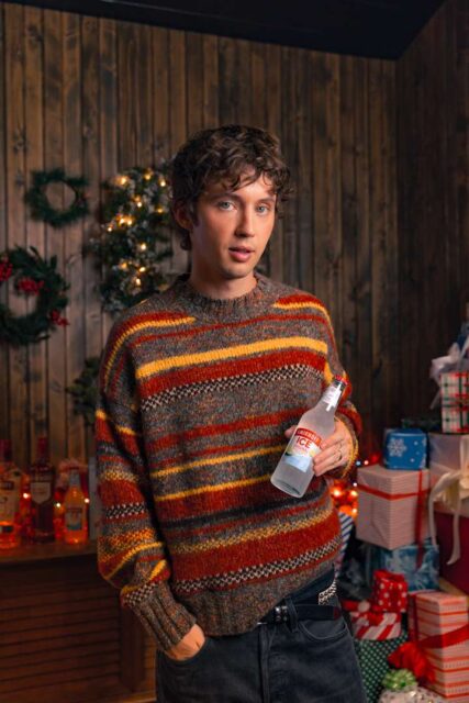 Troye Sivan joins Smirnoff ICE for a playful holiday series, gift boxes, pop-ups, and festive surprises nationwide.