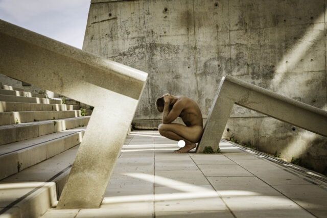 Photos of exposed men in ruins by Ahmad Naser