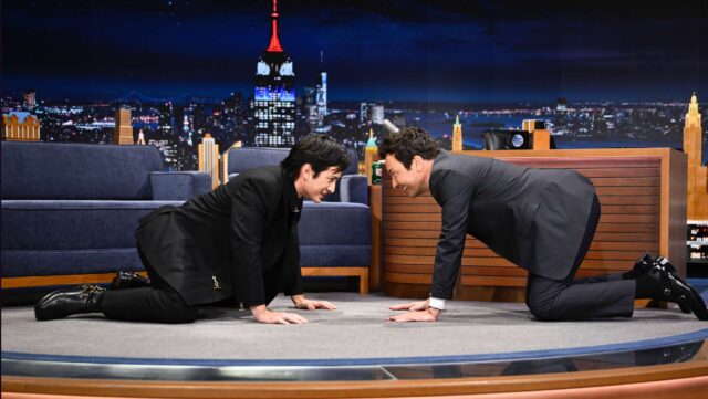 Heated Rivalry star Hudson Williams made his late-night debut on Jimmy Fallon, joking about sex scenes, hockey stretches, and what’s ahead in season two.