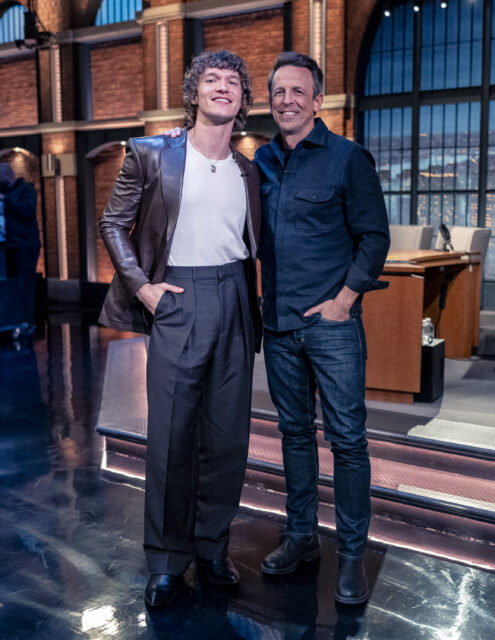 Pictured: (l-r) Actor Connor Storrie and host Seth Meyers during a commercial break on January 12, 2026 --