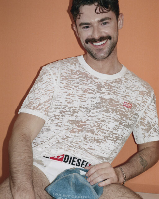 Diesel and Tinder launch a Pride 2026 campaign starring Gigi Goode, plus a queer-focused capsule collection and $200K LGBTQ+ donation.