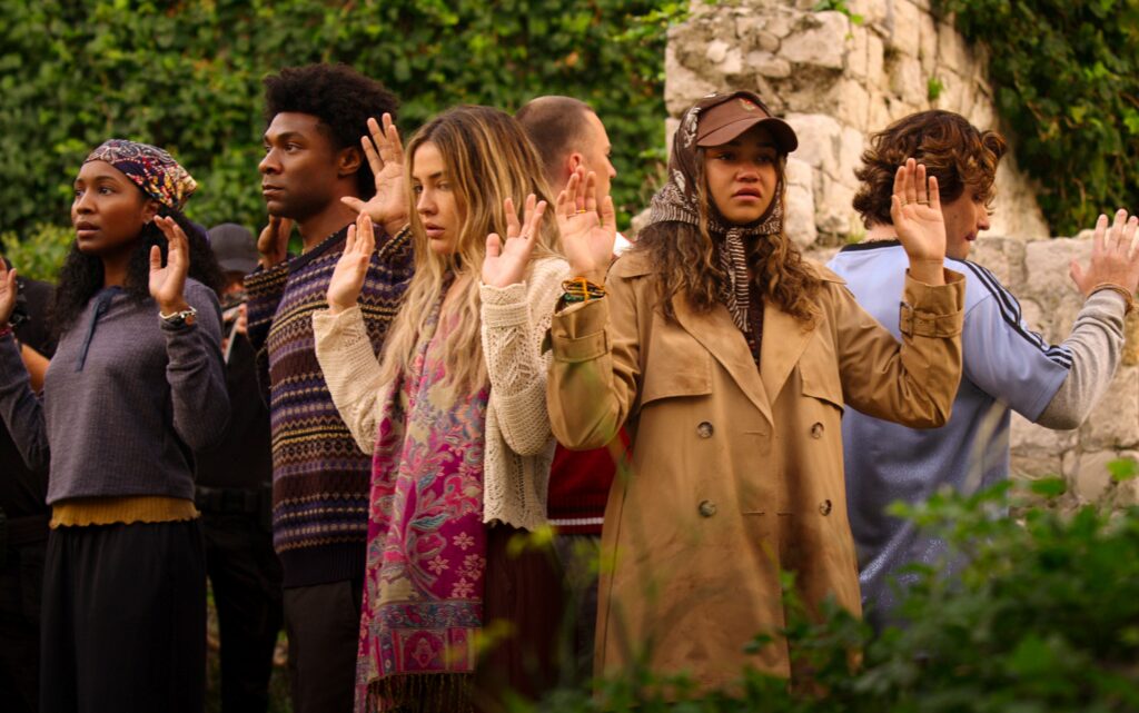 Outer Banks. (L to R) Carlacia Grant as Cleo, Jonathan Daviss as Pope, Madelyn Cline as Sarah Cameron, Drew Starkey as Rafe, Madison Bailey as Kiara, Chase Stokes as John B in episode 503 of Outer Banks. Cr. Courtesy of Netflix © 2026