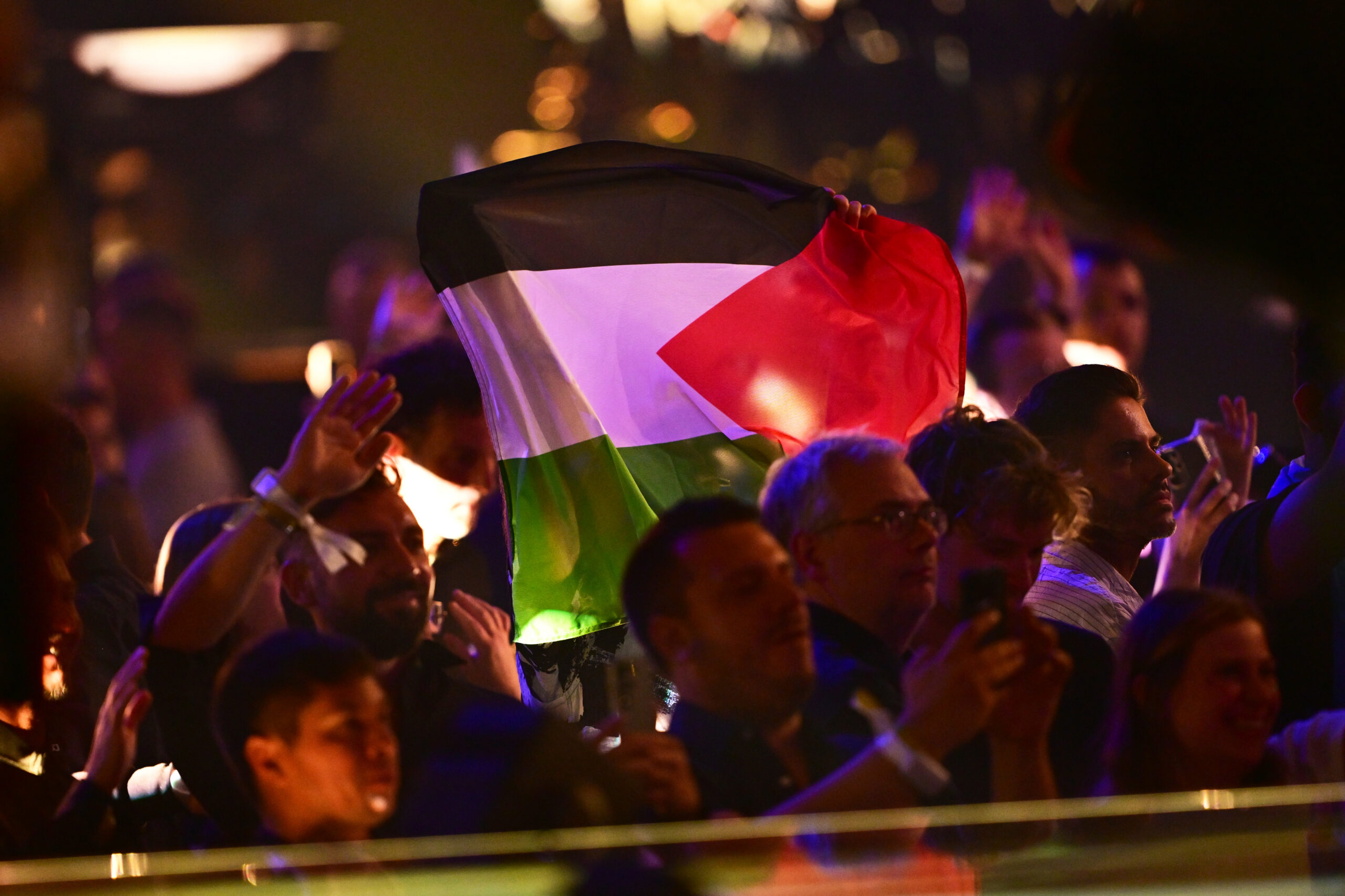 Fans wave a Palestinian flag in the audience at the Eurovision final in Vienna in May 2026.